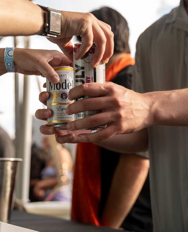 handing guest two drinks handing guest two drinks